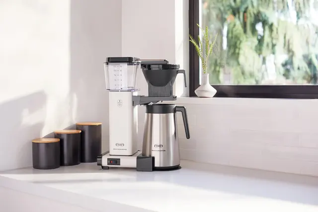 Moccamaster KBGT White by a window