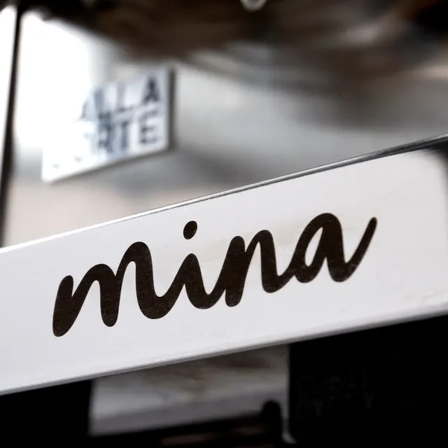 Dalla Corte Mina name on the front panel, close-up