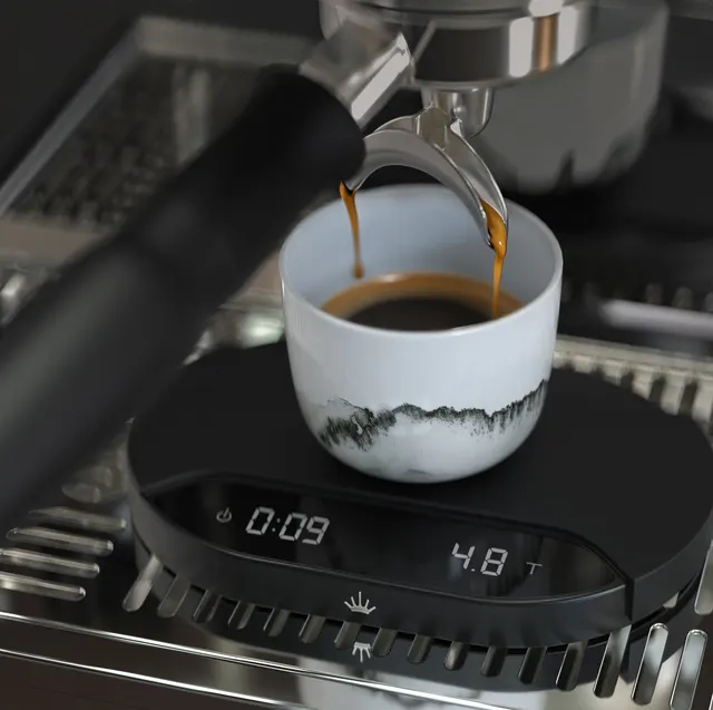 Mahlkönig Sync Scale under an espresso cup on a coffee machine