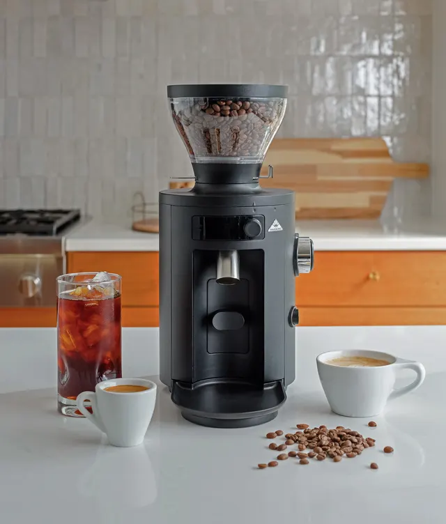 Mahlkönig X54 on a kitchen worktop with coffee cups