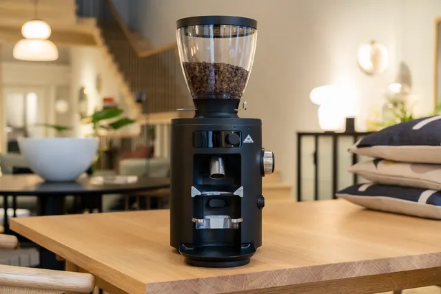 Mahlkönig X54 on a wooden table in a home interior