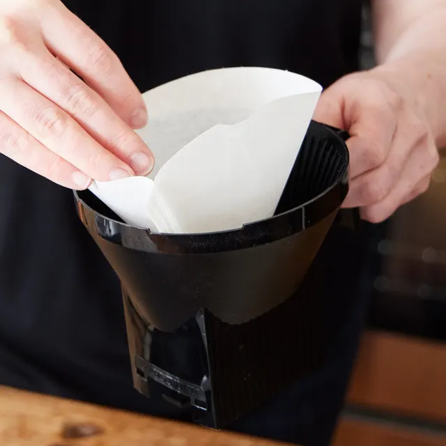 No. 4 paper filter being placed in the filter holder