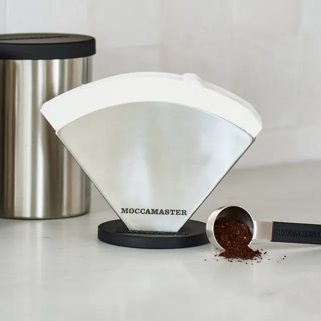 No. 4 paper filter on a stand with a coffee scoop