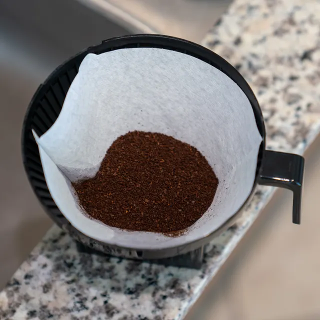 No. 4 paper filter with ground coffee in the filter holder