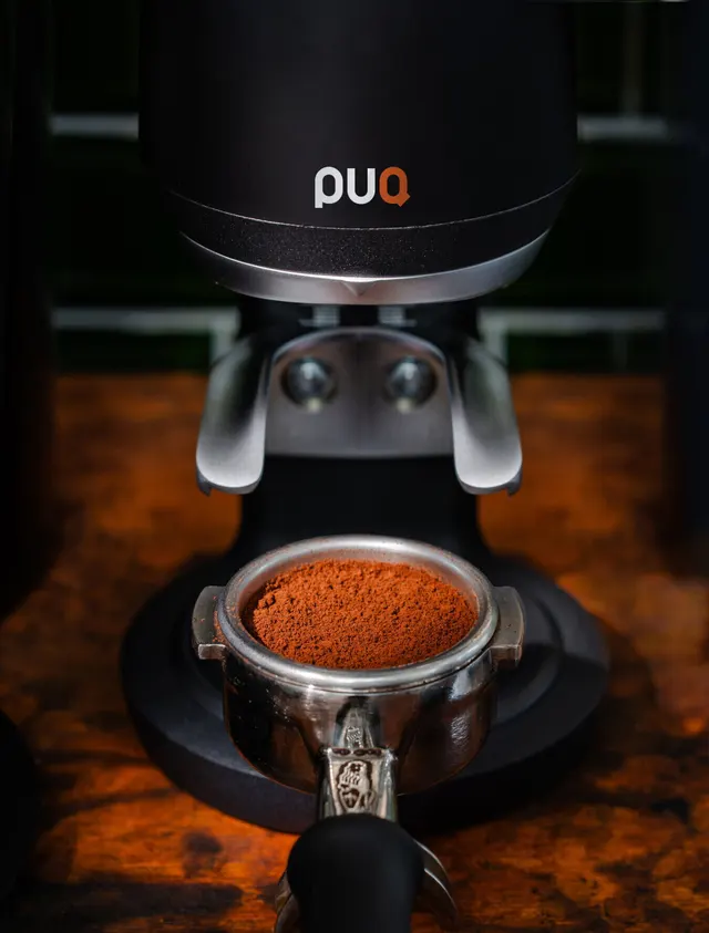 Puq Press Pro with a portafilter full of ground coffee